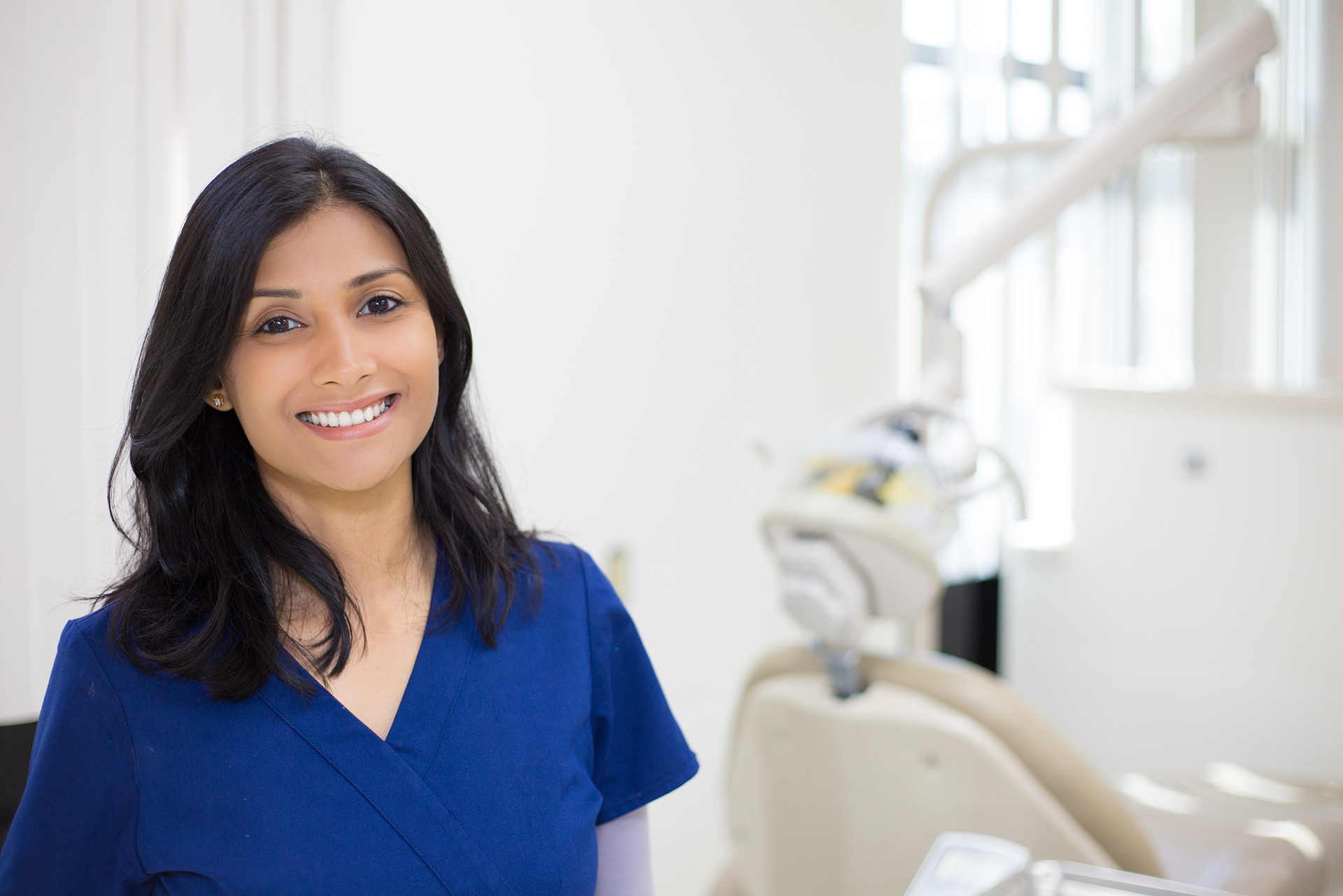 Smiling dental professional in a modern practice